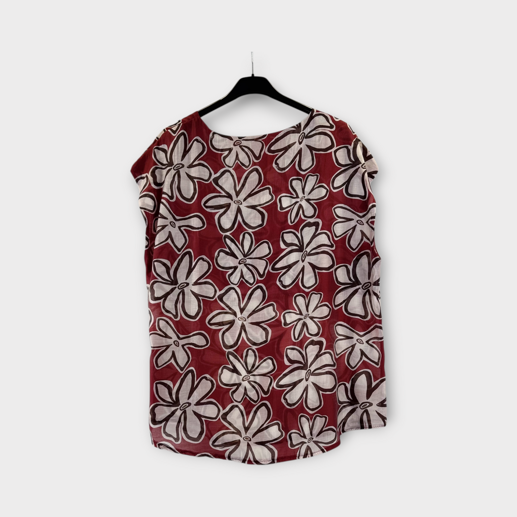 Burgundy blouse with black and white cow print 