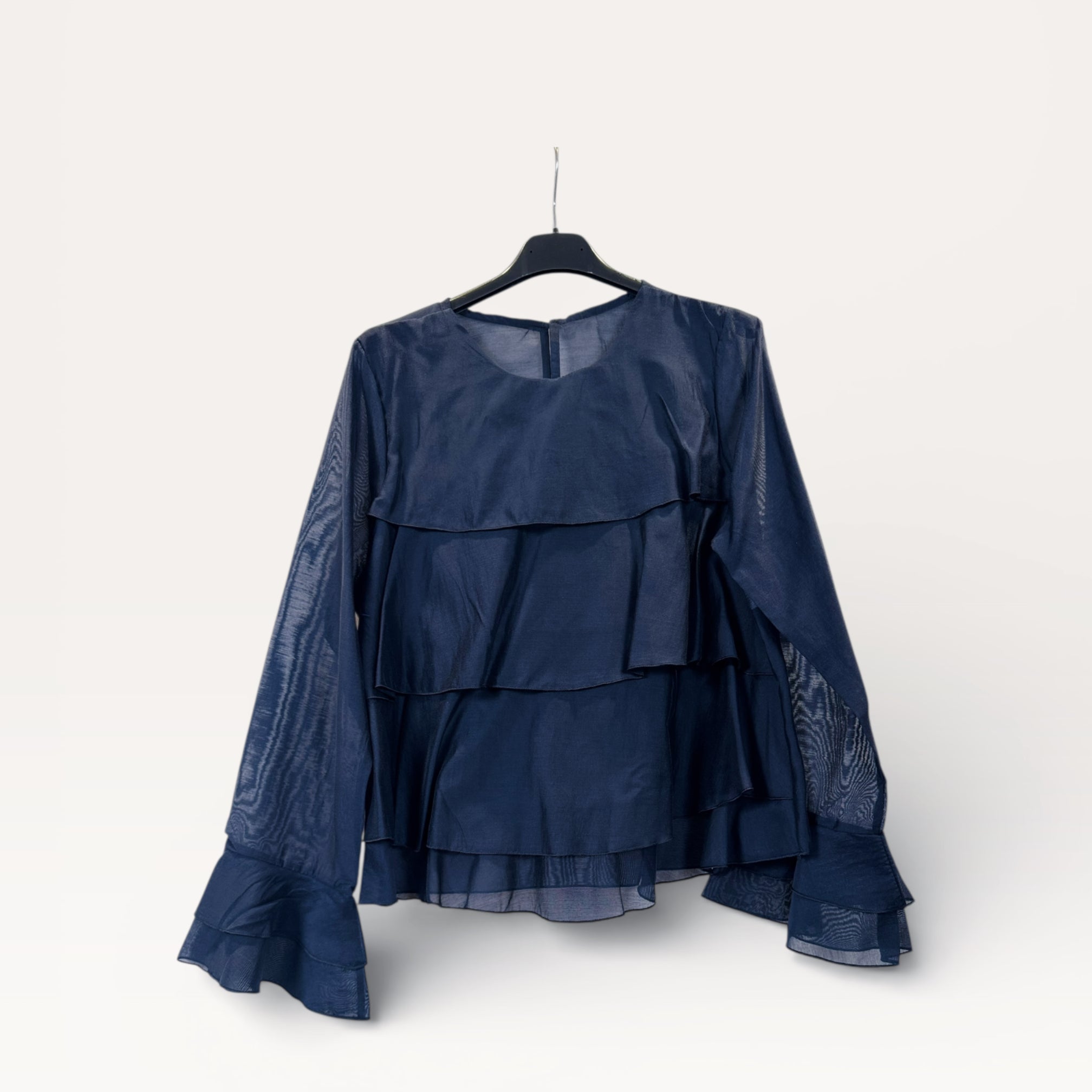 Blusa a balze con volant e maniche a campana