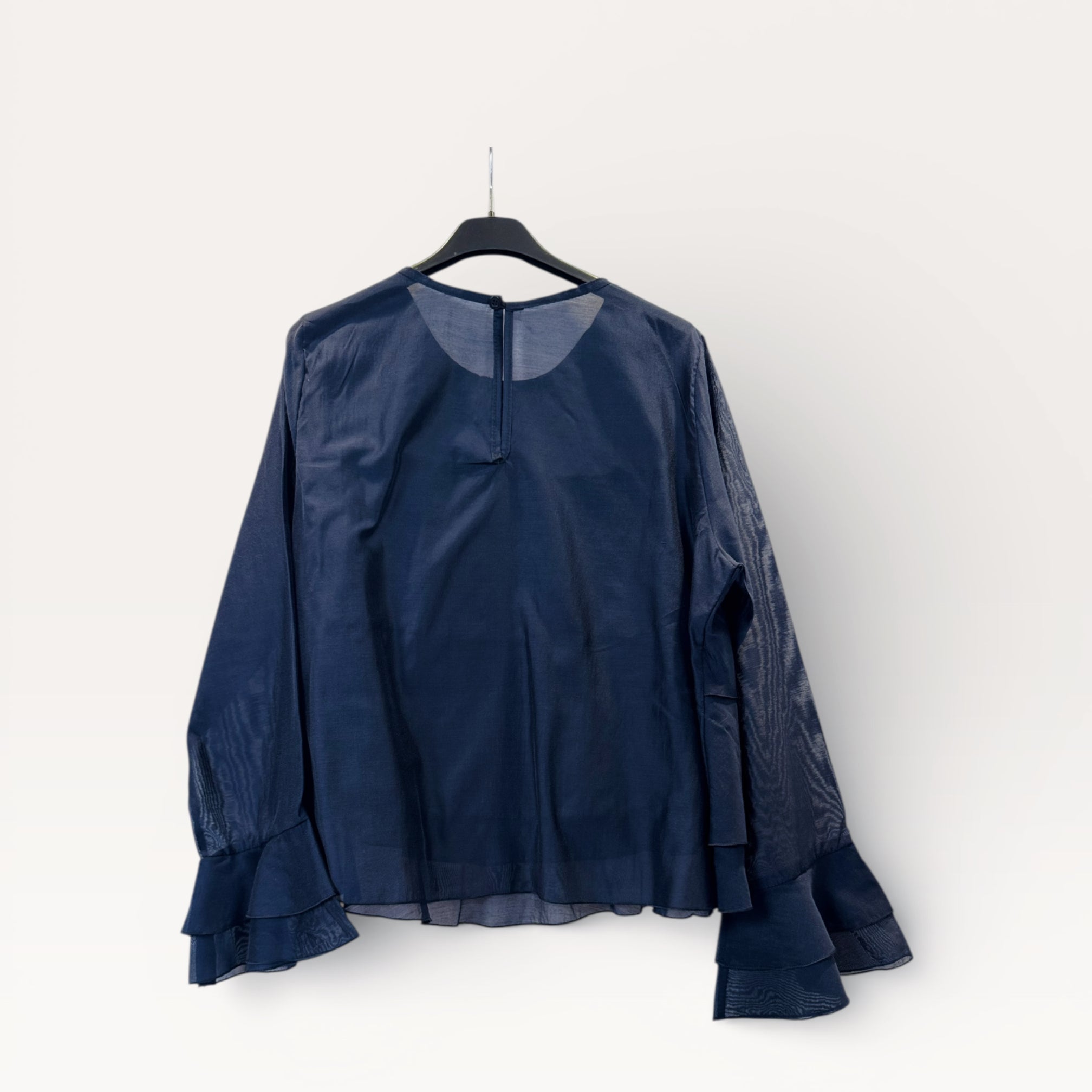 Blusa a balze con volant e maniche a campana