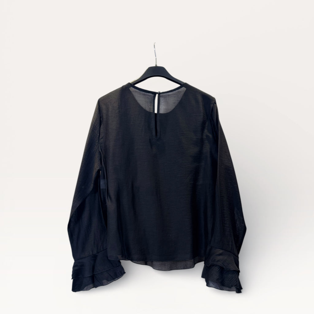 Blusa a balze con volant e maniche a campana