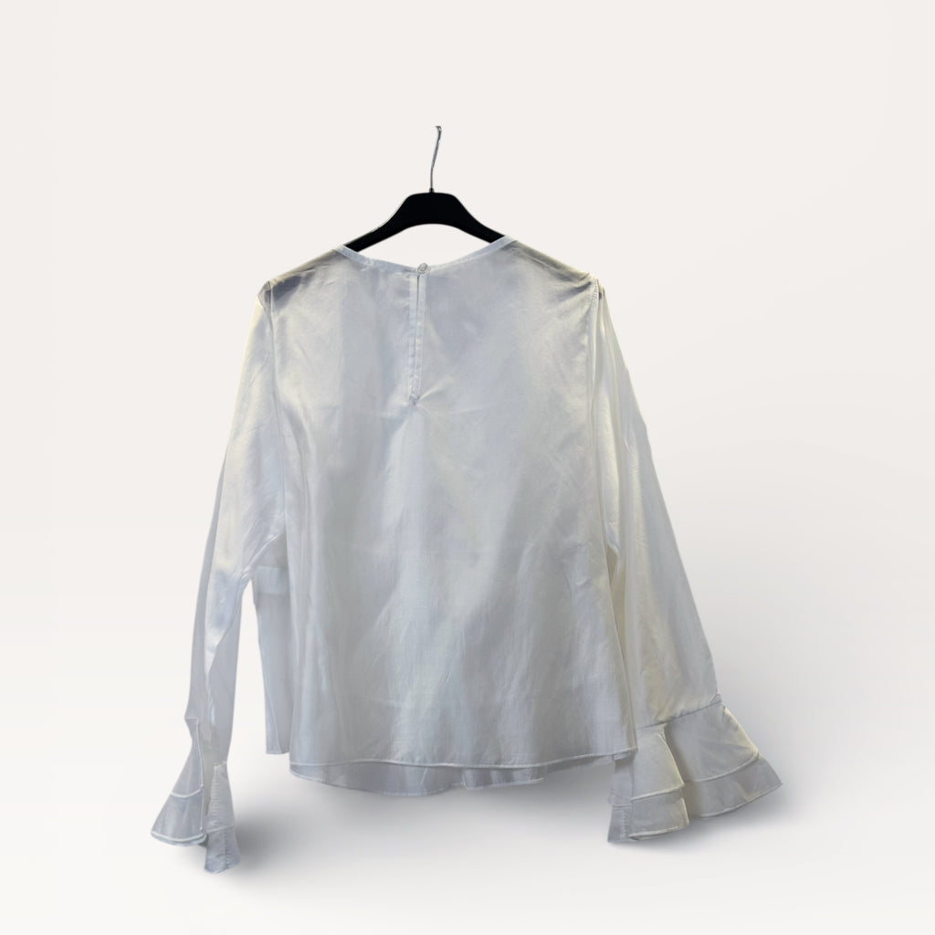 Blusa a balze con volant e maniche a campana