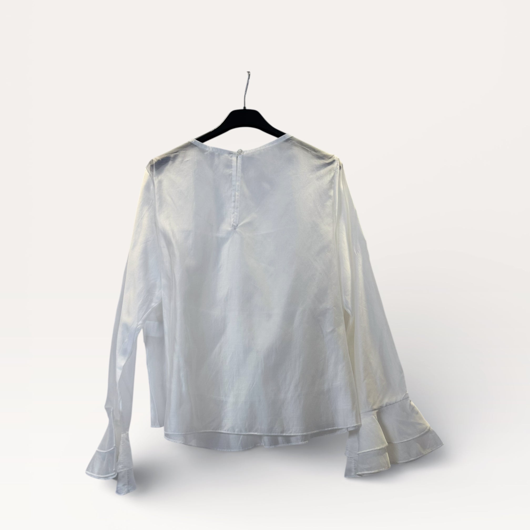 Blusa a balze con volant e maniche a campana
