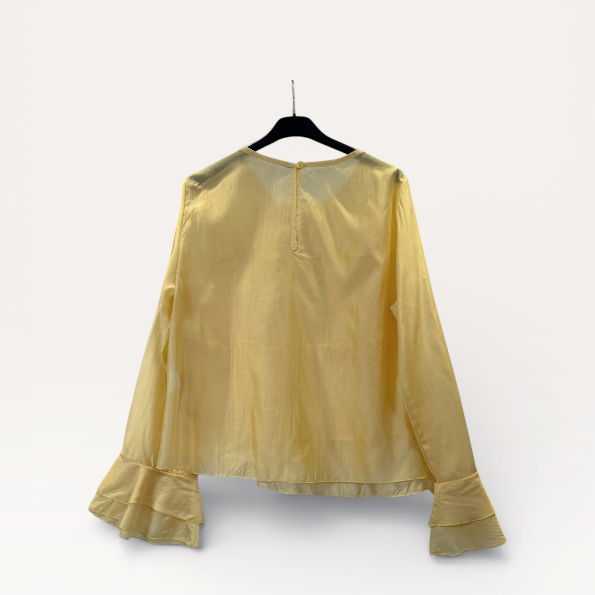 Blusa a balze con volant e maniche a campana